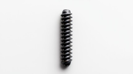 Close-up of a single black metal screw isolated on a white background for industrial and hardware-related design projects.