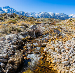 Water Cascading on Lone Pine Creek With Mt. Whitney And The Snow Capped Sierra Nevada Mountain Range, Alabama Hills National Scenic Area, California, USA