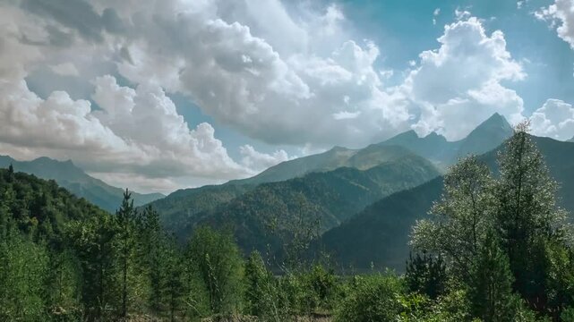 Timelapse of clouds moving over Racha mountains with lush greenery