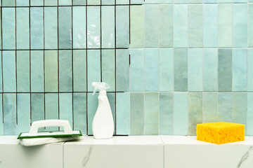 Applying epoxy grout and adhesive to ceramic tiles in a bright bathroom space.