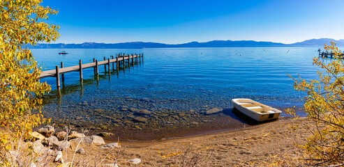 Small Boat With Dock on Pebble Beach at Hurricane Bay, Lake Tahoe, California, USA
