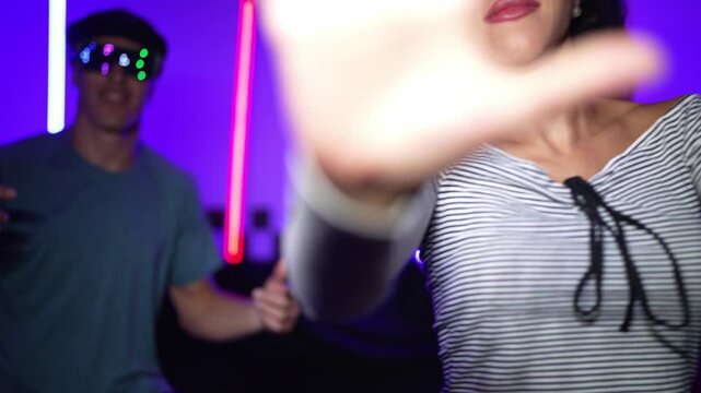 Hispanic street dancer dancing with happy people while looking at camera. Professional performer team moving to music and show lively movement with funny and crazy step dance at studio. Regalement.