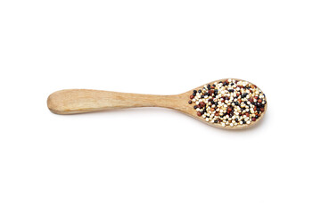 Top view of Organic Tri-color Quinoa (Mixed Quinoa) placed on wooden spoon isolated on white background. Quinoa is a round seed that is high in protein, high in energy, and rich in high fiber.
