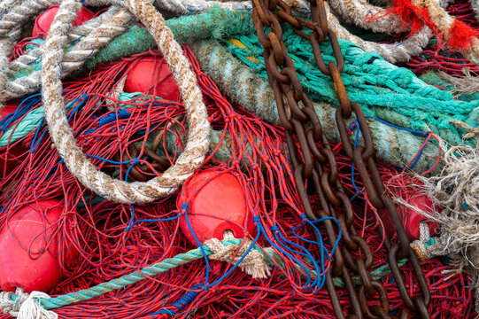 tangled discarded fishing nets - Powered by Adobe