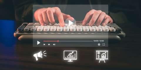 Hands typing on a keyboard with a video player interface and glowing analytics icons overlay, symbolizing content creation and data analysis