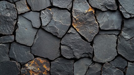 Fototapeta premium Textured black stone wall with irregular shapes 