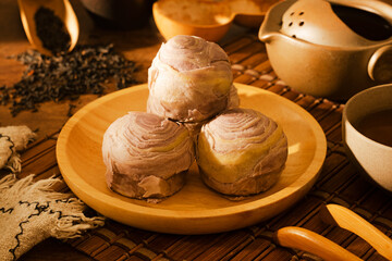 Taro cake on wooden plate and tea set   