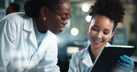 Science, women and smile in lab with tablet, feedback and scientific innovation at night. Research team, tech and pleased with results in facility for advice, pharmaceutical development and overtime