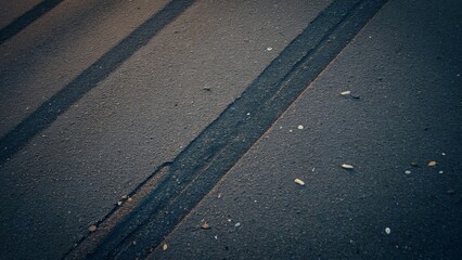 Fototapeta premium High-Resolution Aerial View of Asphalt Road Texture with Tire Tracks