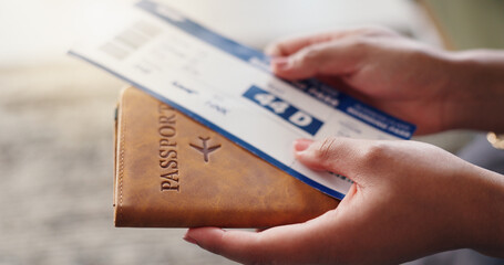 Hands, passport and plane ticket for travel in home with compliance, identity and booking info for...