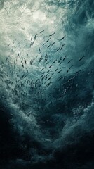 Obraz premium Underwater Elegance Reveals a School of Fish Gracefully Gliding Through Turbulent Ocean Currents in a Serene Display of Nature's Beauty During Twilight Hours