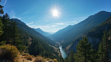 Fototapeta premium Stunning California Mountain River Valley, Sunlit Forest, Blue Sky, High Peaks