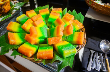 Layer cake, a traditional sweet snack made from flour in colorful layers, originating from...