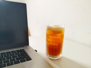 glass of beer with laptop