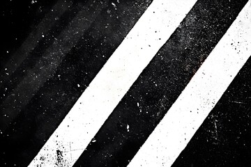 Fototapeta premium A black and white photo of a road with a white stripe