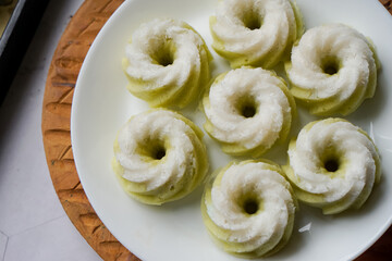 Kuih Puteri Ayu, a popular traditional Malaysian steamed sponge pandan coconut cake.