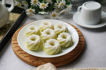 Kuih Puteri Ayu, a popular traditional Malaysian steamed sponge pandan coconut cake.
