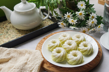 Kuih Puteri Ayu, a popular traditional Malaysian steamed sponge pandan coconut cake.