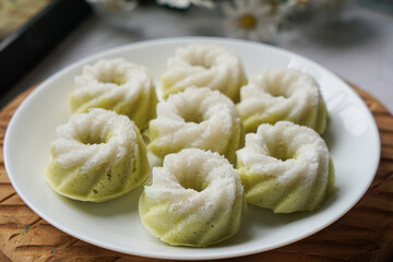 Kuih Puteri Ayu, a popular traditional Malaysian steamed sponge pandan coconut cake.