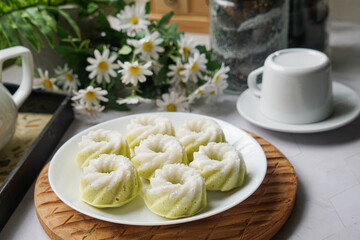 Kuih Puteri Ayu, a popular traditional Malaysian steamed sponge pandan coconut cake.