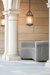 Elegant outdoor seating area featuring woven furniture and stylish lanterns in a serene location