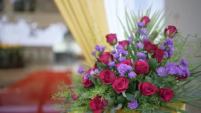 A cinematic view of purple aster and red rose flowers bouquet for wedding decoration