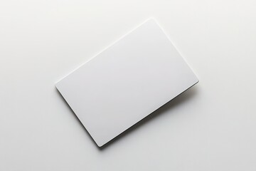 modern keycard lying flat on smooth white backdrop in soft natural light
