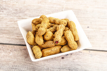 Raw ripe unpeeled peanut heap