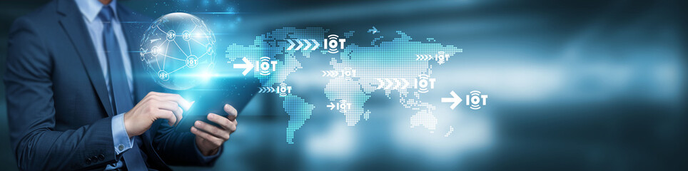 Hand touching a global network connection on a digital interface, connecting points representing technology and futuristic innovation, illustrating the concept of the Internet of Things (IOT).