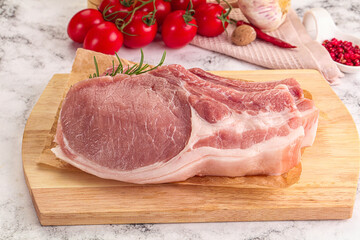 Raw potk loin steak with bone