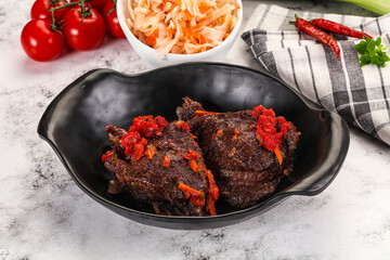 Baked beef cheeks with vegetables