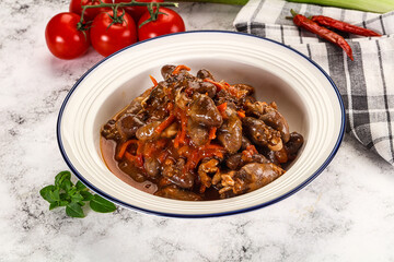 Baked chicken hearts with vegetables