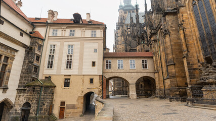 Medieval buildings attached to the impressive St. Vitus Cathedral in Prague, a monumental complex.