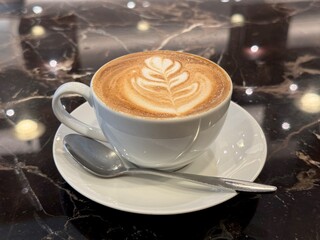 A cup of coffee, with beautiful latte art