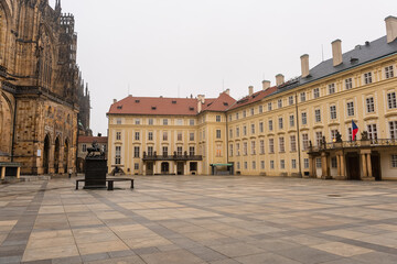 Huge courtyard attached to St. Vitus Cathedral in Prague with its official buildings, Czech...
