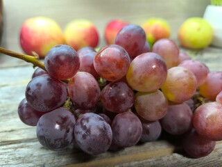 Red ripe juicy grapes on the table.