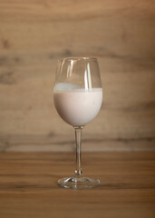 White liqueur served in glass.