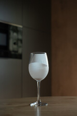 Glass of yogurt on table.