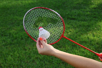 Red racquet and shuttlecock badminton