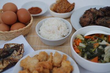 traditional Indonesian food arranged neatly on a white surface