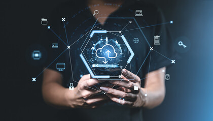 Hands holding smartphone with cloud digital icons on dark backgr