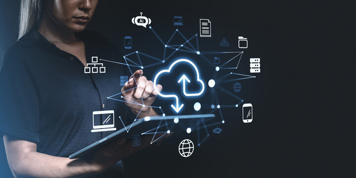 Woman using tablet interacting with cloud computing icons on dig