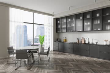 Modern kitchen interior with sleek cabinets, dining table, and chairs, complemented by a large window showing an urban cityscape background. 3D Rendering