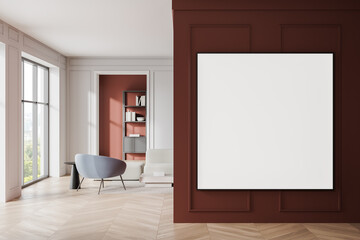 Modern living room interior with large blank white frame, red and white walls, cozy furniture, wooden flooring, and bookshelf in corner. 3D Rendering