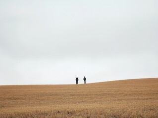 Fototapeta premium Two Figures in Golden Field Under a Pale Sky Solitude, Observation, and Vastness