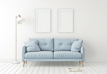 A light blue sofa with two blank picture frames above it in a minimalist white living room with wood floors