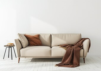 Minimalist living room with a beige sofa. a brown throw blanket. and a black side table