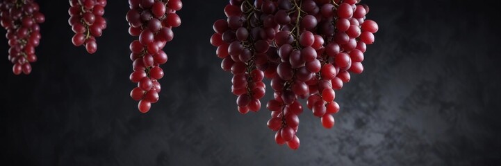 Fototapeta premium Dark background with suspended red grapes, evoking a sense of weightlessness and serenity, ambient, tranquility