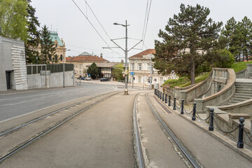 Street with a train track running down the middle