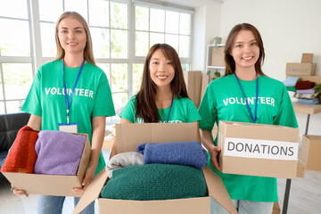 Young volunteers with donations for poor people in center